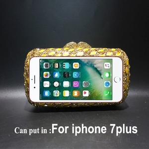 Gold crystal evening bag showing interior capacity with an iPhone 7 Plus for size
