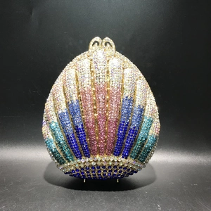 Detailed close-up of gradient crystal rhinestones on shell shaped evening clutch bag