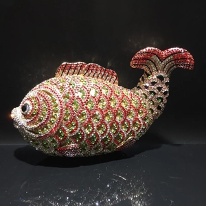 Detailed close-up of a goldfish-shaped evening clutch bag with intricate crystal rhinestones