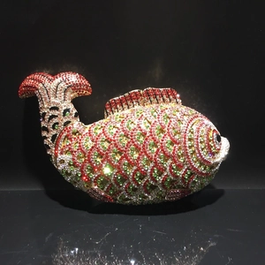 Detailed macro shot of a fish-shaped evening bag featuring multi-color crystals and rhinestones