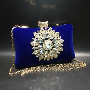 Royal blue velvet evening clutch with sunflower rhinestone ornament and gold chain strap