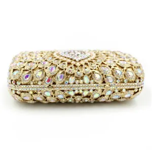 Detail of evening clutch featuring crystal rhinestones and pearl heart embellishment