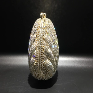 Luxury shell-shaped dinner clutch with sparkling crystals and gold metal hardware