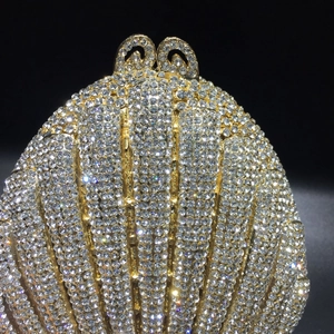 Exquisite shell-shaped evening clutch bag with sparkling crystals and hollow metal clasp