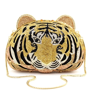 Detailed close-up of crystal tiger head clutch bag with intricate rhinestone embellishment