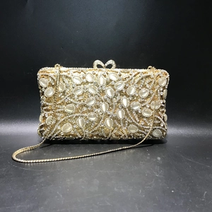 Elegant gold hollow metal evening clutch with moonstone crystals and detachable chain strap