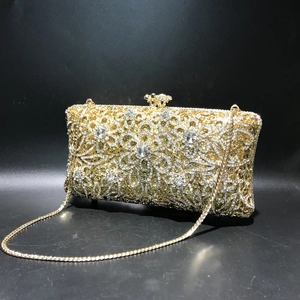 Luxury gold evening clutch with hollow out floral rhinestone patterns and fine chain