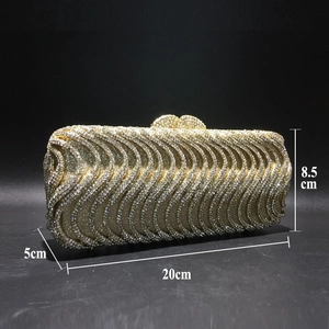 Detail of evening clutch bag showing dimensions 20cm x 8.5cm x 5cm with gold rhinestones
