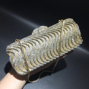 Sparkling crystal evening clutch bag with S-wave rhinestone patterns and golden chain
