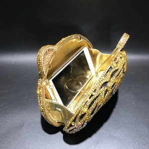 Luxurious tiger head crystal evening clutch with golden lining and metallic chain strap