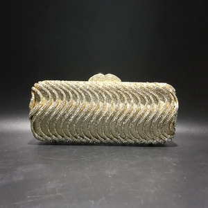 Sparkling gold S-wave pattern evening clutch bag with heart clasp for formal occasions