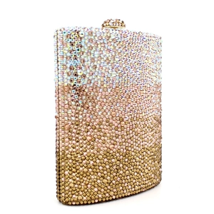 Close-up of pink and gold gradient rhinestones on a luxury evening clutch bag