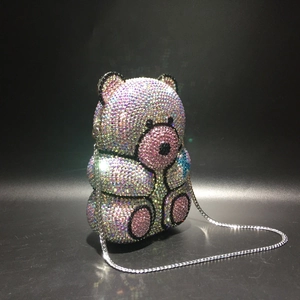 Close-up of luxury teddy bear clutch with handcrafted iridescent rhinestones and silver chain
