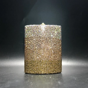 Close-up of sparkling rhinestone evening clutch with gradient champagne gold crystals