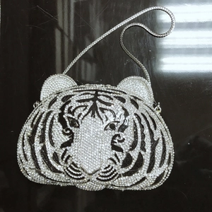 Macro view of crystal tiger head evening clutch bag with black and white rhinestones