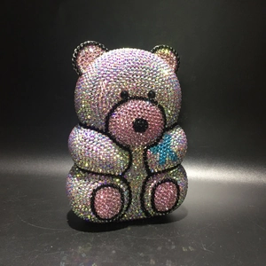 Detailed view of pink crystal teddy bear evening bag with sparkling rhinestone patterns
