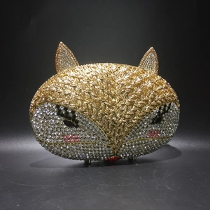 Detailed view of fox-shaped evening clutch with sparkling colorful rhinestone inlay
