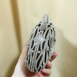 Detailed view of luxury silver tiger head evening bag with rhinestone crystals