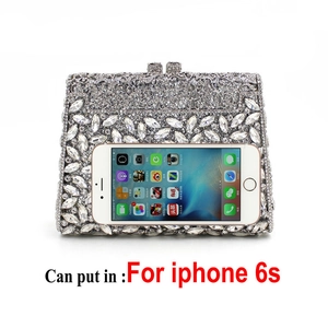 Detail view of silver rhinestone clutch bag showing capacity for an iPhone 6s