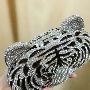 Macro view of exquisite tiger head evening bag with crystal rhinestones and metal details