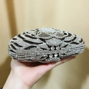 Detailed view of hand-set rhinestones and crystal clasp on luxury evening clutch bag