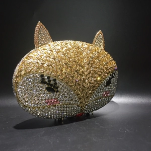 Detailed close-up of a fox-shaped evening clutch bag with intricate crystal rhinestones