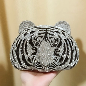 Detailed close-up of tiger-shaped evening bag featuring sparkling inlaid rhinestones