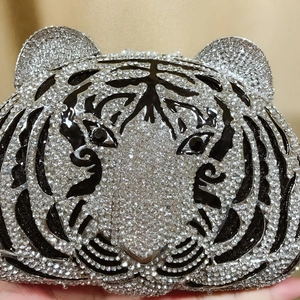 Exquisite close-up of crystal tiger head evening clutch with intricate hand-set rhinestones