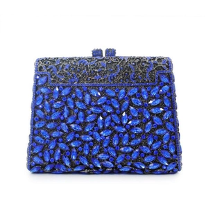 Detailed close-up of luxury navy blue rhinestone evening clutch with ornate metal clasp