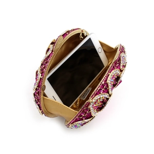 Elegant rhinestone evening clutch with rose red crystals and chain showing phone capacity