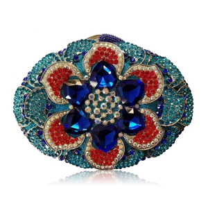 Luxurious oval evening clutch bag with blue heart gemstones and colorful rhinestones