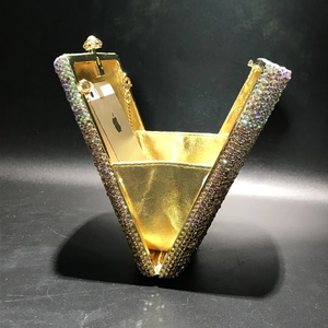Inside view of crystal evening clutch bag showing capacity for a smartphone