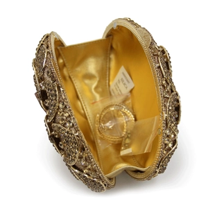 Detailed interior of luxury gold rhinestone evening clutch with chain and satin lining