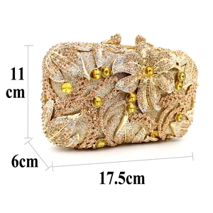 Luxurious gold evening clutch bag with hollow metal floral pattern and crystals