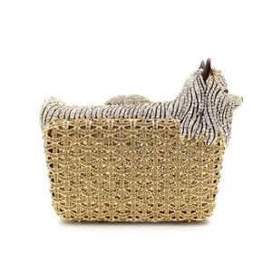 Macro detail of luxury Yorkshire Terrier crystal evening clutch with gold metal frame