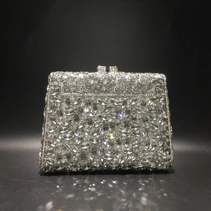 Detailed view of luxury silver evening bag with hand-set marquise and round crystals