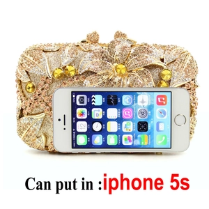 Golden rhinestone evening clutch bag with crystal floral pattern and size reference