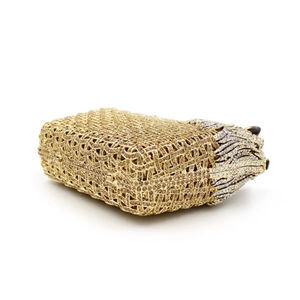 Close-up of golden crystal evening clutch with a tiger head design and mesh texture