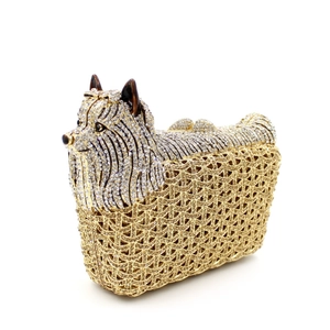 Detailed macro view of luxury Yorkshire terrier crystal clutch with gold rhinestone accents