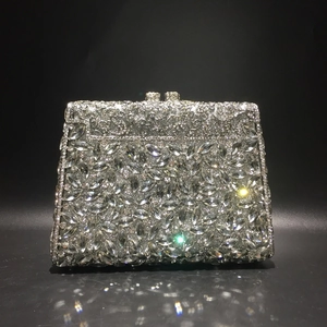 Elegant silver evening clutch bag with marquise rhinestones on black mirror reflection