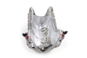 Macro view of the luxury animal-themed clutch interior with sparkling crystals and silver chain