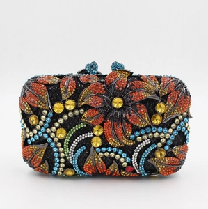 Detailed view of colorful rhinestones on a black floral metal clutch evening bag