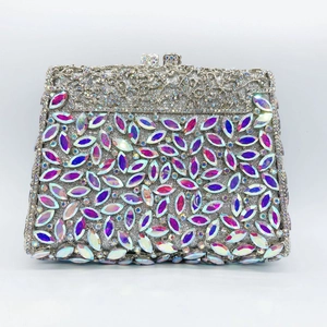 Detailed view of silver hollow metal craft and AB rhinestones on evening clutch bag