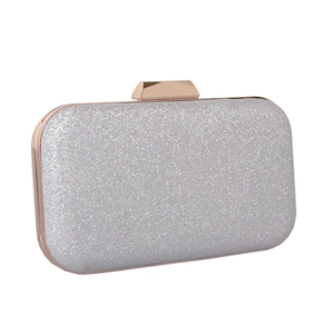 Detail of silver glitter evening clutch bag with rose gold metal frame and geometric clasp