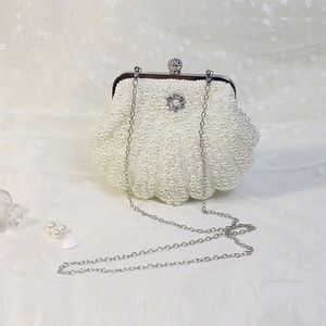 Handmade pearl shell evening clutch with rhinestone clasp and silver metal chain strap