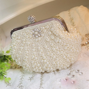 Handmade pearl clutch evening bag with beaded shells and sparkling crystal floral closure