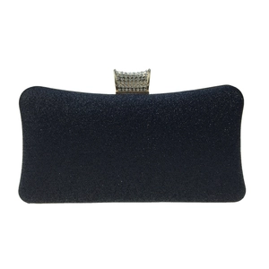Detail view of navy blue glitter evening clutch with sparkling rhinestone gold clasp