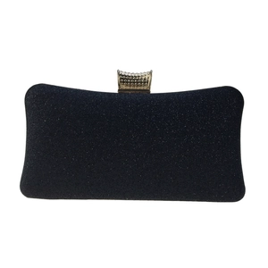 Close-up of black glitter clutch bag featuring a gold metal clasp with dotted texture