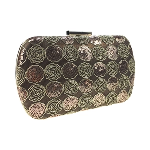 Detailed view of champagne gold evening clutch with rose embroidery and sequins