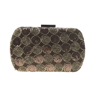 Detailed view of rose floral pattern with sequins on a rectangular evening clutch bag
